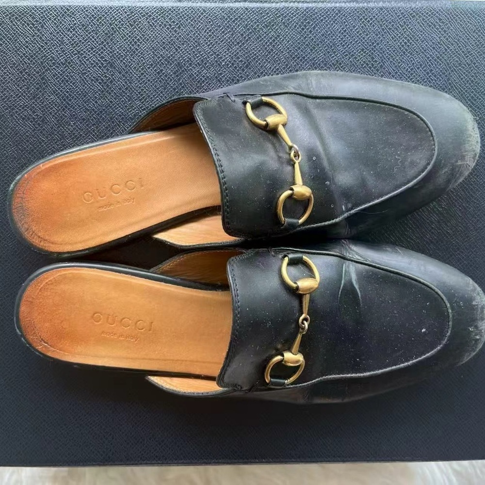 Gucci Black Leather Mules with Gold Accents